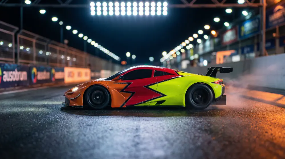 On-road RC cars mid-race on the HUR track